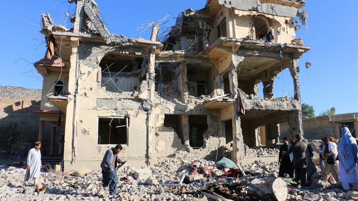 Residents and Taliban members gather near a destroyed building following an airstrike that the Taliban say was carried out by Pakistan's security forces, in Samkani district, Afghanistan, June 29, 2026. REUTERS/Stringer