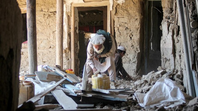 An Afghan resident clears rubble from his home at the site of a Pakistani airstrike in Barolo village in the Marawara district of Afghanistan's Kunar province on June 29, 2026. Pakistan launched its deadliest attack on Afghanistan in months, with Isl