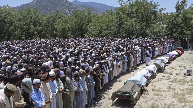 Afghan mourners and relatives offer funeral prayers for Pakistani airstrike victims at a village in Tsamkani district of Afghanistan's Paktia province on June 29, 2026. Pakistani airstrikes killed dozens of people overnight in eastern Afghanistan, wi