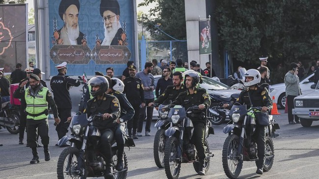 Members of the Police Special forces ride on bikes on the day international delegates participate in a farewell ceremony for Iran's late Supreme Leader Ayatollah Ali Khamenei, who was killed on February 28 during Israeli and U.S. airstrikes on Iran,