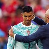 Soccer Football - FIFA World Cup 2026 - Round of 32 - Portugal v Croatia - Toronto Stadium, Toronto, Canada - July 2, 2026 Portugal's Cristiano Ronaldo with coach Roberto Martinez as he reacts after being substituted off REUTERS/Mike Segar