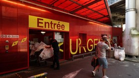 French firefighters arrive with a patient on a stretcher at the Emergency Department of the ​​Nantes CHU Hospital in Nantes, France, June 26, 2026. REUTERS/Stephane Mahe