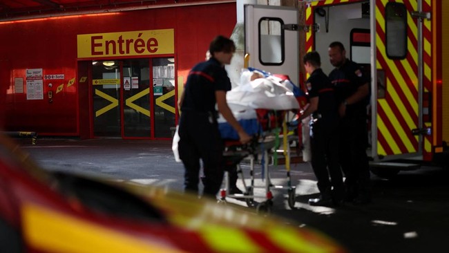 French firefighters arrive with a patient on a stretcher at the Emergency Department of the ​​Nantes CHU Hospital in Nantes, France, June 26, 2026. REUTERS/Stephane Mahe