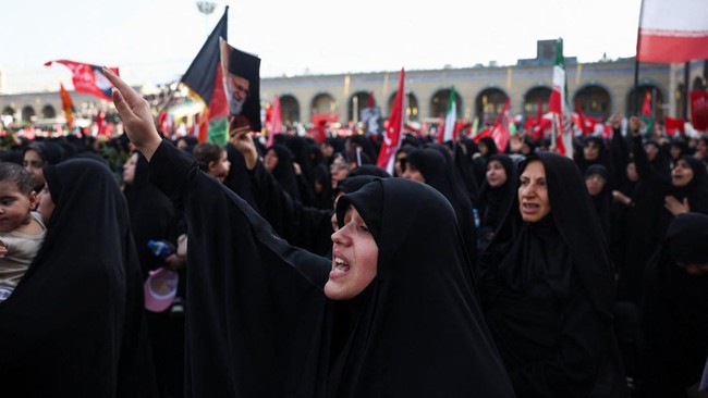 A woman reacts as mourners gather on the day of a public farewell ceremony to pay their respects to late Supreme Leader Ayatollah Ali Khamenei, who was killed on February 28 in Israeli and U.S. airstrikes, at the Imam Khomeini Grand Mosalla, in Tehra