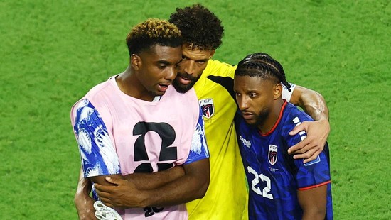 Soccer Football - FIFA World Cup 2026 - Round of 32 - Argentina v Cape Verde - Miami Stadium, Miami Gardens, Florida, U.S. - July 3, 2026 Cape Verde's Vozinha hugs Logan Costa and Steven Moreira after the match as Cape Verde are eliminated from the W