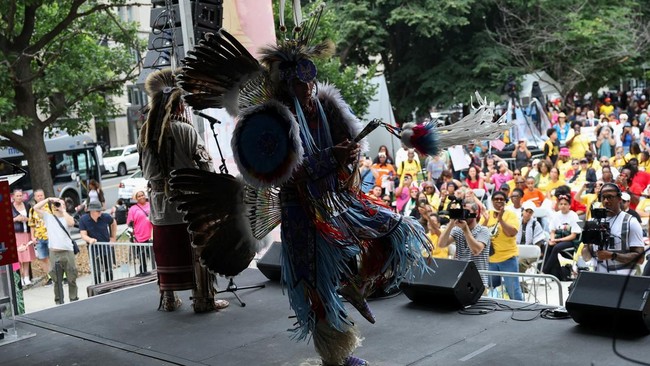 Chaske Hill of Rosebud Sioux performs a traditional indigenous dance in association with the Piscataway Indian Nation dancers, as people attend the "The Next250 Is For All of Us" event, a protest response to U.S. President Donald Trump's official "Fr