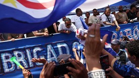 Soccer Football - FIFA World Cup 2026 - Cape Verde arrive home in Praia - Praia, Cape Verde - July 5, 2026 Cape Verde players on their team bus during the parade as fans welcome them after they arrive from the United States REUTERS/Sodiq Adelakun