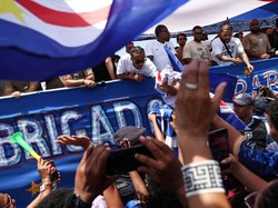 Soccer Football - FIFA World Cup 2026 - Cape Verde arrive home in Praia - Praia, Cape Verde - July 5, 2026 Cape Verde players on their team bus during the parade as fans welcome them after they arrive from the United States REUTERS/Sodiq Adelakun
