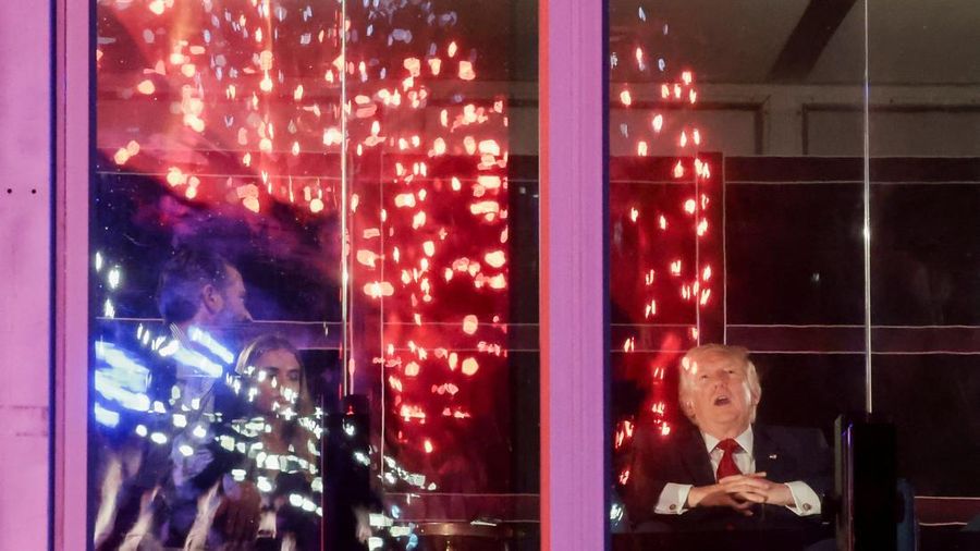 U.S. President Donald Trump watches fireworks explode during the Freedom 250's Salute to America as the United States celebrates its 250th anniversary on Independence Day, attempting the largest firework display in history with 850,000 fireworks in W