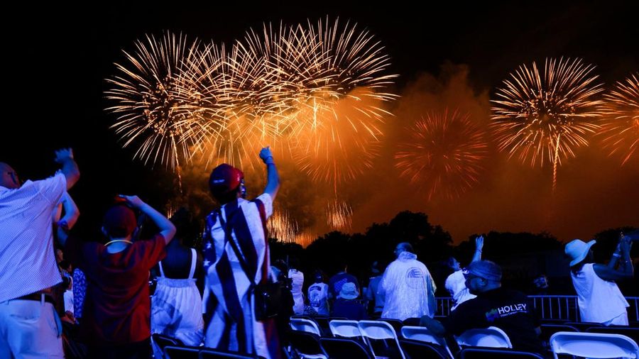 People watch a fireworks display that is attempting the largest firework display in history with 850,000 fireworks, at a Fourth of July rally featuring U.S. President Donald Trump, marking the 250th anniversary of U.S. independence, on the National M
