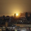 An explosion lights up the sky over the city as Ukrainian servicemen hit a Russian missile during a Russian missile and drone strike, amid Russia's attack on Ukraine, in Kyiv, Ukraine July 6, 2026. REUTERS/Gleb Garanich