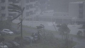 Strong wind brought by Super Typhoon Bavi hits Guam on July 6, 2026. (Photo by Yuichi YAMAZAKI / AFP)