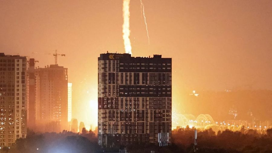 An explosion lights up the sky over the city during a Russian missile and drone strike, amid Russia's attack on Ukraine, in Kyiv, Ukraine July 6, 2026. REUTERS/Vladyslav Sodel