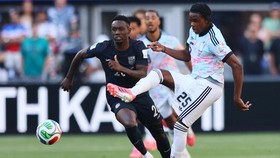 Soccer Football - FIFA World Cup 2026 - Round of 16 - United States v Belgium - Seattle Stadium, Seattle, Washington, U.S. - July 6, 2026 Belgium's Nathan Ngoy in action with Folarin Balogun of the U.S. IMAGN IMAGES via Reuters/Blake Dahlin