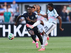Soccer Football - FIFA World Cup 2026 - Round of 16 - United States v Belgium - Seattle Stadium, Seattle, Washington, U.S. - July 6, 2026 Belgium's Nathan Ngoy in action with Folarin Balogun of the U.S. IMAGN IMAGES via Reuters/Blake Dahlin
