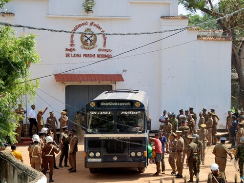Prisoners board a bus to be transferred to another prison following clashes between two groups of inmates at Negombo Prison in the coastal town of Negombo, Sri Lanka, July 6, 2026. REUTERS/Lahiru Harshana