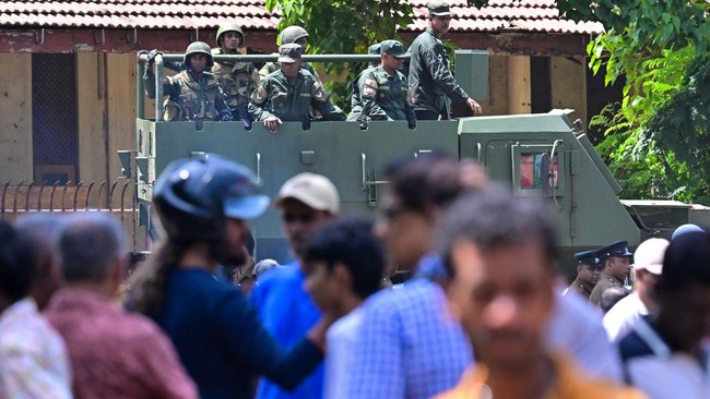Army officers patrol near the Negombo prison on the outskirts of Colombo on July 7, 2026, following clashes between inmates of two drug gangs. Clashes in a Sri Lankan jail have killed 23 people, including four guards, and wounded more than 100 in the