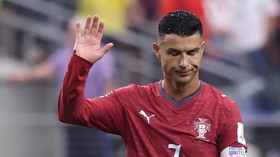 Portugal's forward #07 Cristiano Ronaldo waves to fans after losing the 2026 World Cup round of 16 football match between Portugal and Spain at the Dallas Stadium in Arlington on July 6, 2026. (Photo by Thomas COEX / AFP)
