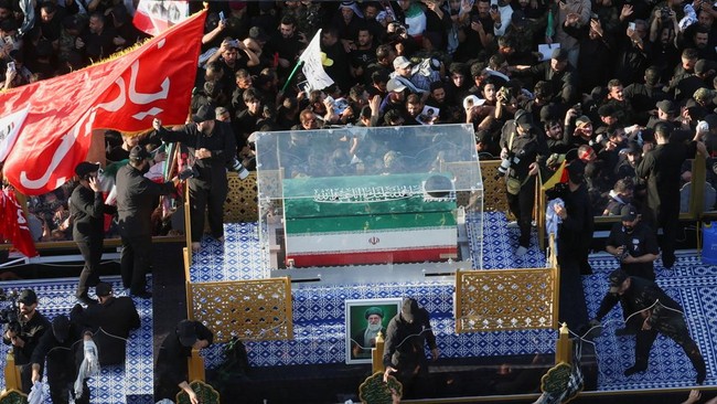 A vehicle carrying the coffin of Iran's late Supreme Leader Ayatollah Ali Khamenei, who was killed on February 28 in Israeli and U.S. airstrikes, makes its way as people attend Khamenei's funeral procession, in Najaf, Iraq, July 8, 2026. REUTERS/Alaa