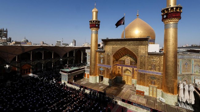 People gather on the day of a funeral procession for Iran's late Supreme Leader Ayatollah Ali Khamenei, who was killed on February 28 in Israeli and U.S. airstrikes, at the Imam Ali Shrine in Najaf, Iraq, July 8, 2026. REUTERS/Thaier Al-Sudani
