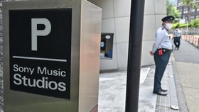 Members of security stand outside the entrance to the Sony Music Studios offices in downtown Tokyo on May 30, 2024. (Photo by Richard A. Brooks / AFP)