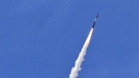 This picture taken from a position in the Upper Galilee region in northern Israel shows an Israeli Iron Dome missile streaking accross the sky to intercept incoming projectiles on May 31, 2026. Israel's military said on May 31 its forces were advanci