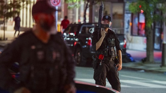 Public Safety Response Team police officers clear the area following a shooting at the Salsa on St. Clair Festival in Toronto, Canada, on July 11, 2026. Police in Toronto were searching Saturday night, July 11, for an active shooter who had killed tw