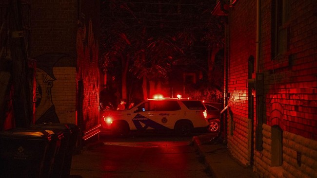 A paramedic vehicle is parked on a street near the site of a shooting that occurred at the Salsa on St. Clair Festival in Toronto on the evening of July 11, 2026. Police in Toronto were searching Saturday night, July 11, for an active shooter who had