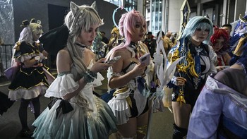 Cosplayers arrive outside the venue of the Bilibili World 2026 in Shanghai on July 12, 2026. (Photo by Hector RETAMAL / AFP)