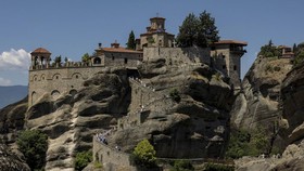 Tourists visit the Monastery of Varlaam in Meteora, near Kalambaka, Greece, July 12, 2026. REUTERS/Louiza Vradi