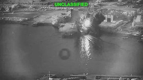 Smoke rises after a U.S. one-way attack surface drone reached its target, a submarine and ship maintenance facility according to U.S. Central Command, in Bandar Abbas, Iran, in this screengrab taken from a video, which was released July 13, 2026.  U.