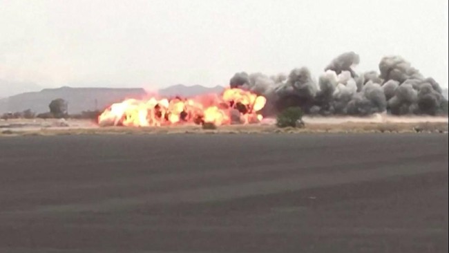 This screen grab taken from video footage released by the Houthi rebels' Al-Masirah TV channel and made available via AFPTV on July 13, 2026, shows airstrikes hitting Sanaa airport. The leader of Yemen's internationally recognised governing council s