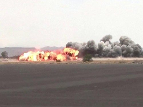 This screen grab taken from video footage released by the Houthi rebels' Al-Masirah TV channel and made available via AFPTV on July 13, 2026, shows airstrikes hitting Sanaa airport. The leader of Yemen's internationally recognised governing council s