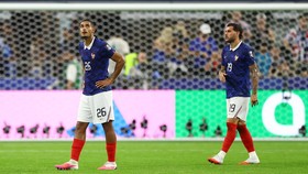 Soccer Football - FIFA World Cup 2026 - Semi Final - France v Spain - Dallas Stadium, Arlington, Texas, U.S. - July 14, 2026 France's Maxence Lacroix and Theo Hernandez look dejected after the match following their elimination from the World Cup REUT