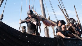 Matt Damon (frame left, with bow) is Odysseus in THE ODYSSEY, written, produced, and directed by Christopher Nolan.