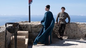 L to R: Anne Hathaway is Penelope and Tom Holland is Telemachus in THE ODYSSEY, written, produced, and directed by Christopher Nolan.