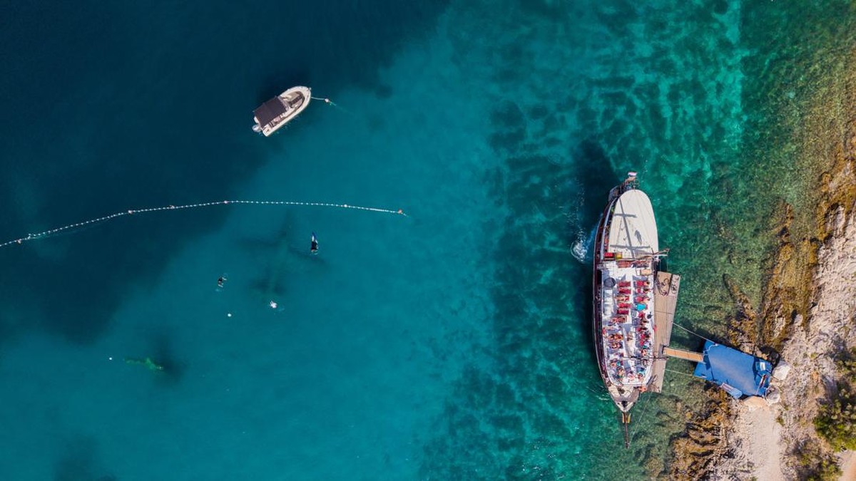 A drone view shows people snorkeling at the Underwater Museum in Jelinak Bay near Trogir, Croatia, July 17, 2026. REUTERS/Antonio Bronic