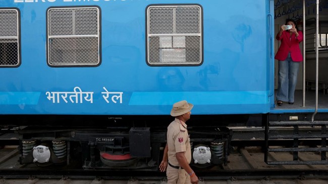 An officer from Railway Protection Special Force (RPSF) walks beside the Namo Green Rail, India's first hydrogen-powered train during a media visit ahead of its flag off by the Prime Minister Narendra Modi in Jind, Haryana, India, July 16, 2026. REUT