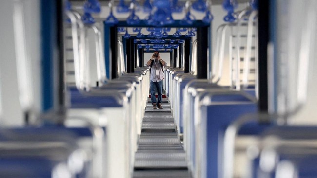 A media member takes pictures inside Namo Green Rail, India's first hydrogen-powered train during a media visit ahead of its flag off by the Prime Minister Narendra Modi in Jind, Haryana, India, July 16, 2026. REUTERS/Bhawika Chhabra/File Photo