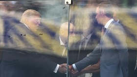 US President Donald Trump (L) shakes hands with Spain's Prime Minister Pedro Sanchez next to FIFA President Gianni Infantino (C) ahead of the 2026 World Cup football tournament final match between Spain and Argentina at the New York/New Jersey Stadiu