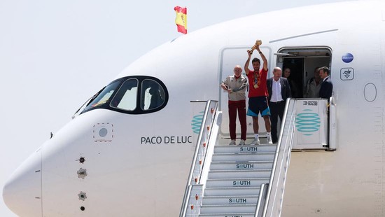 Soccer Football - FIFA World Cup 2026 - Spain players return to Madrid after winning the World Cup - Madrid, Spain - July 20, 2026 Spain's Rodri with the World Cup trophy during the team's arrival at Madrid