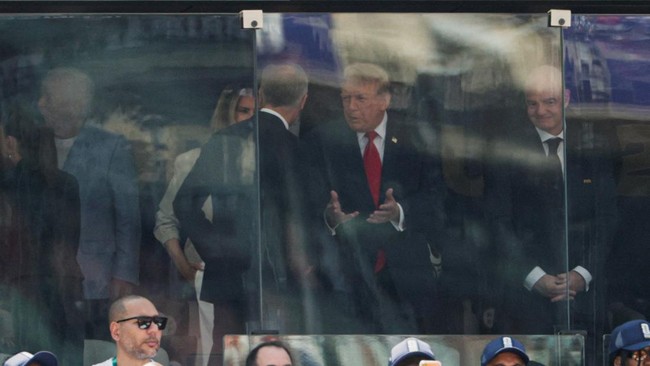 U.S. President Donald Trump speaks with Canada's Prime Minister Mark Carney next to FIFA President Gianni Infantino before the FIFA World Cup 2026 Final between Spain and Argentina at New York New Jersey Stadium in East Rutherford, New Jersey, U.S.,