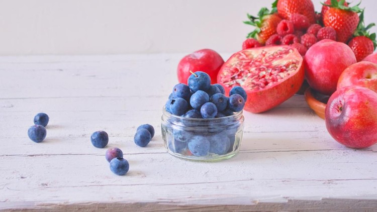 Red fruits on white wooden table - red summer fruits on rustic white wooden table - healthy eating&comma; copy space&comma; concepts & ideas