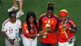 Soccer Football - FIFA World Cup 2026 - Final - Spain v Argentina - New York/New Jersey Stadium, East Rutherford, New Jersey, U.S. - July 19, 2026 Spain's Nico Williams celebrates with the trophy alongside mother Maria and father Felix after winning