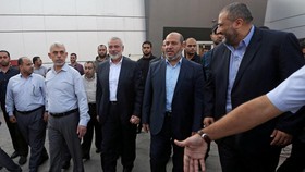 FILE PHOTO: Hamas Gaza Chief Yahya Al-Sinwar, Hamas Chief Ismail Haniyeh and senior Hamas leader Khalil al-Hayya arrive at the Rafah border crossing in the southern Gaza Strip September 19, 2017. REUTERS/Ibraheem Abu Mustafa/File Photo