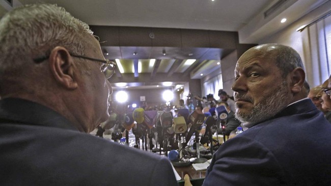 Hamas arab relations chief Khalil al-Hayya (R) and secretary general of the Popular Front for the Liberation of Palestine-General Command, Talal Naji, hold a press conference during a visit to the Syrian capital Damascus on October 19, 2022 for the f