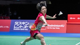 Japans Akane Yamaguchi hits a return against Indias Pusarla Venkata Sindhu in their women's singles final match of the Japan Open badminton tournament at Tokyo Gymnasium in Tokyo on July 19, 2026. (Photo by Yuichi YAMAZAKI / AFP)