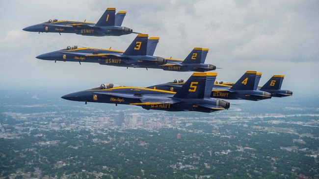 This handout image courtesy of the US Navy shows the U.S. Navy Flight Demonstration Squadron, the Blue Angels honoring frontline COVID-19 first responders and essential workers with formation flights over Little Rock, Arkansas on May 14, 2020. 