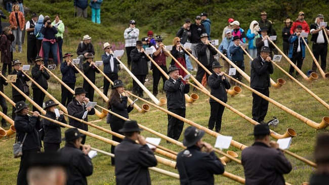 Alphorn blowers perform an ensemble piece on the last day of the International Alphorn Festival on the alpine pasture of Tracouet in Nendaz, in southern Switzerland, July 26, 2026. REUTERS/Pierre Albouy