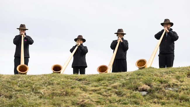 Alphorn blowers on the last day of the International Alphorn Festival on the alpine pasture of Tracouet in Nendaz, in southern Switzerland, July 26, 2026. REUTERS/Pierre Albouy